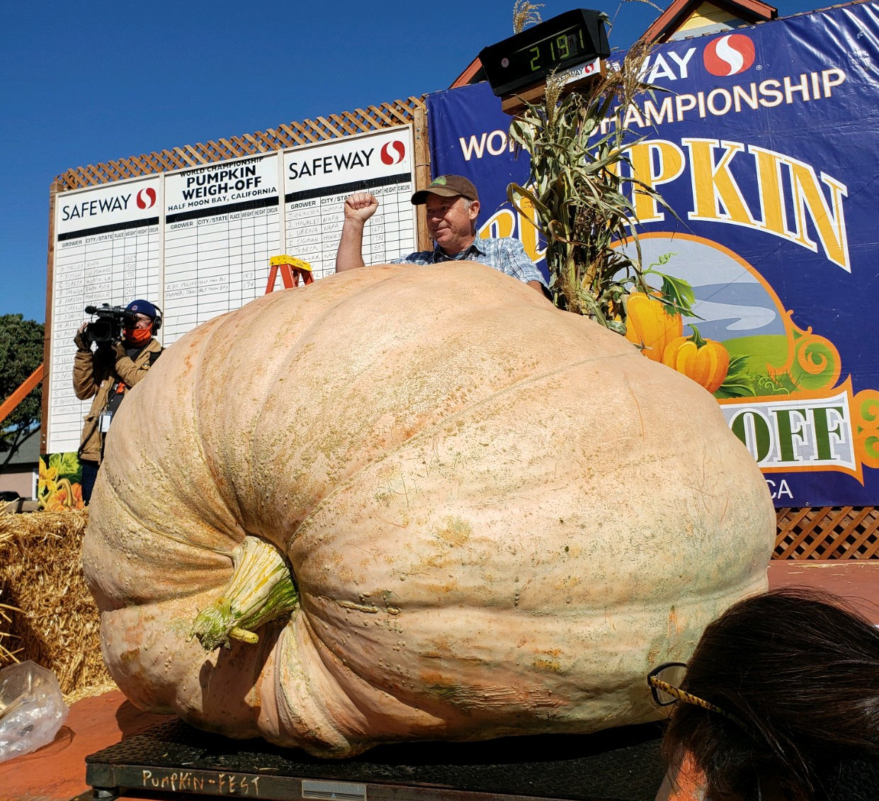 Jeff Uhlmeyer is shown standing behind his world-champion giant pumpkin in October 2021.